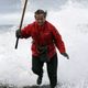 Elvira, a barnacles collector or a “percebeira’, escapes from a wave as she hunts for Gooseneck barnacles ahead of Christmas celebrations in the rough waters of Cape Roncudo, A Coruna, in the northwestern Spanish province of Galicia on Dec. 22.